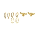 Detail of gold moon and star earring set with zircon inlays and artistic face designs - Abstract Face Bee Earring Set