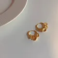 Orecchini pendenti dorati con dischi a pieghe in elegante stile lusso minimalista - Orecchini in oro a cerchi multipli