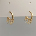 Golden hoop earrings with celestial star and moon pendants on white display card - Gold Moon and Star Tassel Earrings