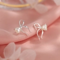 Elegant silver bow stud earrings featuring a heart pearl on soft pink silk fabric - Silver Heart Pearl Bow Stud Earrings