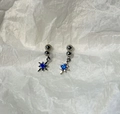 Detail of star-shaped stud earrings with blue gemstone on wrinkled background - Round Bead Blue Star Pendant Stud Earrings