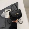 Chic black litchi pattern saddle bag with gold metal hardware and rounded handle - Black