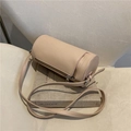 Minimalist beige cylindrical shoulder bag on a vintage book with adjustable strap - Khaki