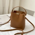 Brown leather bucket bag with top handle and gold magnetic closure for women - Tan