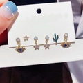 Detail of bohemian gold earring set with evil eye, stars and cactus charms on card - Evil Eye Cactus Earring Set