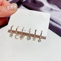 Detail of 6-piece gold earrings set with rhinestones featuring crown moon and star charms - Star Moon Zircon Earring Set