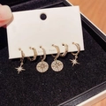 Detail of three pairs of gold star and moon tassel earrings set with zircon accents - Full Rhinestone Star Set
