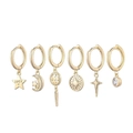 Detail of 6-piece gold hoop earring set featuring star, moon, and LUCK engraved charms - Star Moon Zirconia Set
