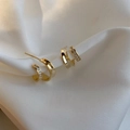Double-layered gold C-shape stud earrings with pavé zircons on soft white silk fabric - Gold Double Layer C-shape Ear Studs