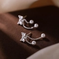 Detailed macro view of silver bow stud earrings with rhinestones and pearl tassels - Bowknot Pearl Tassel Stud Earrings