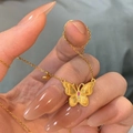 Golden butterfly pendant necklace featuring brushed texture wings and pink gemstones - Frosted Butterfly Style (Butterfly Necklace)