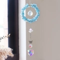 Detail van kristallen zonnevanger met blauwe stenen, vlinder en hartvormige hanger - Aquamarijn (6001515769289)