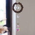 Detail van kristallen zonnevanger met tijgeroog kralen, vlinder en hartvormige hanger - Tijgeroog (6001515769292)