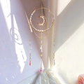 Close-up of golden moon sun catcher with natural crystal stones and rainbow prisms - RD5-Opalite