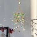 Aventurine moon sun catcher with crystal prisms casting rainbow shadows on wall - Aventurine Crystal Moon And Star Suncatcher