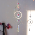 Detail of crystal suncatcher with natural stones reflecting rainbow light on a wall - Clear Quartz (N0.4 白水晶)