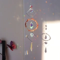 Detailed view of crystal suncatcher casting vibrant rainbow reflections on the wall - Red Agate (N0.6 红玛瑙)