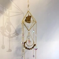 Detailed view of rhombic metal suncatcher with amethyst stones and crystal drops - Tiger Eye Stone Bracelet
