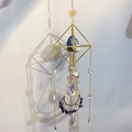 Detail of suncatcher with amethyst crystal moon pendant and golden metal frame - Lapis Lazuli