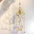 Detailed close-up of golden diamond frame suncatcher with purple crystal beads - Citrine