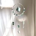 Close-up of bohemian sun catcher with green crystals and silver metal ring - Aventurine Style (RB4)
