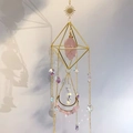 Detail of pink crystal suncatcher with golden diamond frame and lunar stone pendant - Rose Quartz