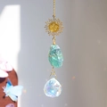 Detail of sun catcher featuring green fluorite stone and crystal ball with rainbow refraction - 35cm / Green Fluorite