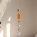 Close-up of bohemian suncatcher with orange agate slice and colorful prism crystals - Orange Agate Style (B32)