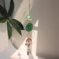 Detail of suncatcher with green agate slice and crystal pendant casting rainbow reflections - Green Agate Style (B34)