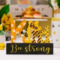 Bee Kind wooden tabletop sign with yellow daisy and honeycomb patterns on a brown base - Kind Style (Bee strong)