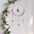 Detail of handmade suncatcher featuring gold rings, blue raw stones and crystal charms - Lapis Lazuli (RC6)