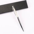 Detailed view of silver crystal ballpoint pen with decorative white stones and elegant gift box - Blue Moonstone