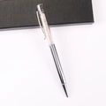 Close-up of silver metal ballpoint pen with pink crystal stones in a luxury gift box - Rose Quartz
