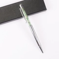Detail of silver crystal ballpoint pen featuring green gemstone chips and black gift box - Aventurine Jade