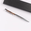 Detailed view of a silver crystal ballpoint pen with brown crushed tiger eye stones in a box - Tiger Eye Stone Bracelet