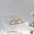 Detail of golden cloud earrings with crystal raindrops hanging from a glass rim - Cloud Raindrop Short Style (5.5cm)