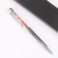 Detail of silver metal ballpoint pen with red crystal stones and black gift box - Red Agate