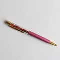 Detail of rose red ballpoint pen with orange crushed crystal stones and gold accents - Red Agate / 14cm Black Ink Refill