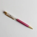 Macro detail of a rose pink crystal pen with white crushed stones and gold plating - Blue Moonstone / 14cm Black Ink Refill
