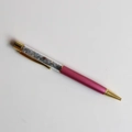 Detail of rose red crystal ballpoint pen with blue-grey gravel in clear barrel - Angelite / 14cm Black Ink Refill