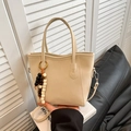 Beige faux leather bucket bag with wooden bead charm and adjustable crossbody strap - No Pendant / White