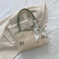 Straw tote bag with green leather trim, embroidery, and floral scarf decoration - Green