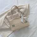 Beige woven straw tote bag with embroidery and floral scarf detail on white background - Off White