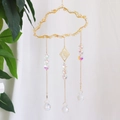 Cloud-shaped crystal suncatcher with yellow stones and gold moon charms on white background - CA3-Citrine