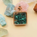 Detailed view of square gold perfume bottle pendant with green crystal stone filler - Malachite / 29mm