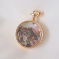 Macro shot of circular gold pendant filled with colorful crushed natural stone crystals - Mixed Tourmaline / 29mm