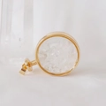 Macro shot of circular gold perfume pendant filled with natural clear crystal stones - White Crystal / 29mm