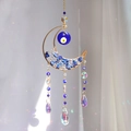 Moon suncatcher with blue crystal stones and evil eye beads creating rainbow light - Moon Evil Eye - Lapis Lazuli Style / Blue