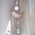 Pink crystal moon suncatcher with evil eye charm and hanging glass beads creating rainbows - Rose Quartz