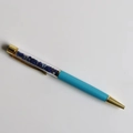 Detail of creative crystal stone ballpoint pen with gold clip and blue minerals inside - Lapis Lazuli